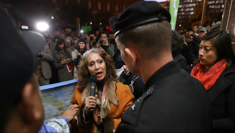 LaDonna Brave Bull Allard (C) of Cannon Ball, North Dakota, talks with Maj. Gen. Donald Jackson of the Army Corps of Engineers during a demonstration against the proposed Dakota Access Pipeline outside the Corps headquarters November 15, 2016 in Washington, DC. Photo via Getty